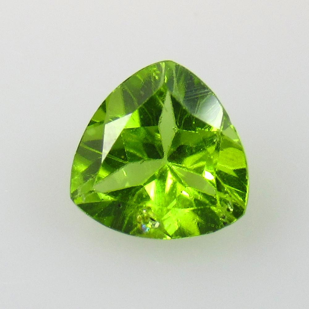 1.75 Ct Natural Pakistan Peridot Trillion Cut: No Reserve! Title: 1.75 Ct Natural Pakistan Peridot Trillion Cut Stone Clarity: VVS Gemstones: Natural Peridot Carat Weights: 1.75 Size/Dimensions: 8.00 x 8.00 x 4.50 mm Additional Information: Top Cl