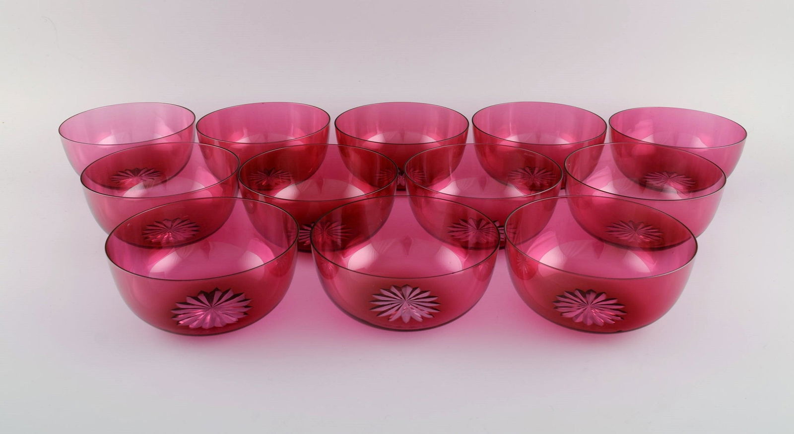 Set of twelve Holmegaard bowls in pink art glass. Danish design, mid-20th century.: Title: Set of twelve Holmegaard bowls in pink art glass. Danish design, mid-20th century. Description: Set of twelve Holmegaard bowls in pink art glass. Danish design, mid-20th century. Measures: 12.5