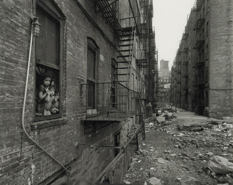 BRUCE DAVIDSON - East 100th Street, 1966-68: Artist: Bruce Davidson Title: East 100th Street, 1966-68 Medium: Photo Litho, 2009, Germany Dimensions: 9.6x7.65" Description: Heat Wax Mounted on 11x14" Conservation Board Artist Bio: Bruce Davidson