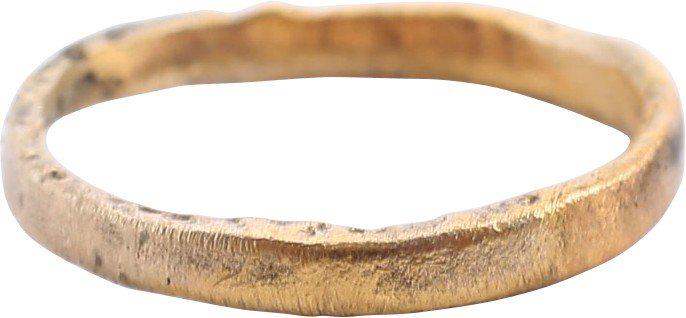 VIKING WEDDING RING, 10 TH -11 TH CENTURY AD.: Size 1 1/4 for the small finger as was the custom. Gilt bronze. 1.9mm width. Surface lightly textured from burial. Professionally refurbished with the 24karat gold overlay restored. See the reference