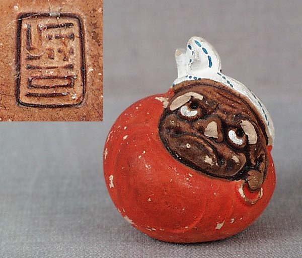 Netsuke DARUMA DOLL marked: Unusual late Meiji - early Taisho ceramic netsuke in a shape of a cloth toy of Daruma - the founder of Zen Buddhism. Wonderfully designed, good quality modeling, great depiction on the soft body of th