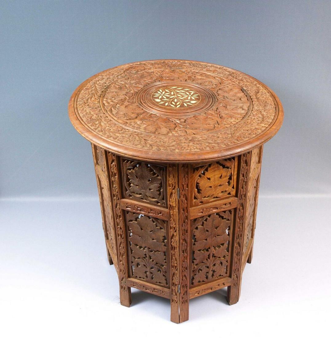 Carved Wood Rosewood Teak Folding Anglo-Indian Wine Coffee TABLE Folding inlays: This is a quality example of the classic late 19th early 20th century Indian Carved table on a folding wood base. The table is in very good antique order. It has pleasing detailing on the top with whi