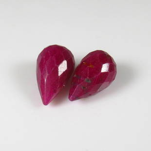 Natural Red Ruby Beads - 7.11 Ct: No Reserve! Title: Natural Red Ruby Beads - 7.11 Ct Origin: Mozambique Weight: 7.11 Size/Dimensions: 10.5 x 6.5 x 6.5 mm Additional Information: Pieces : 2 No's / Shape : Drilled Pear Drop / Color : R