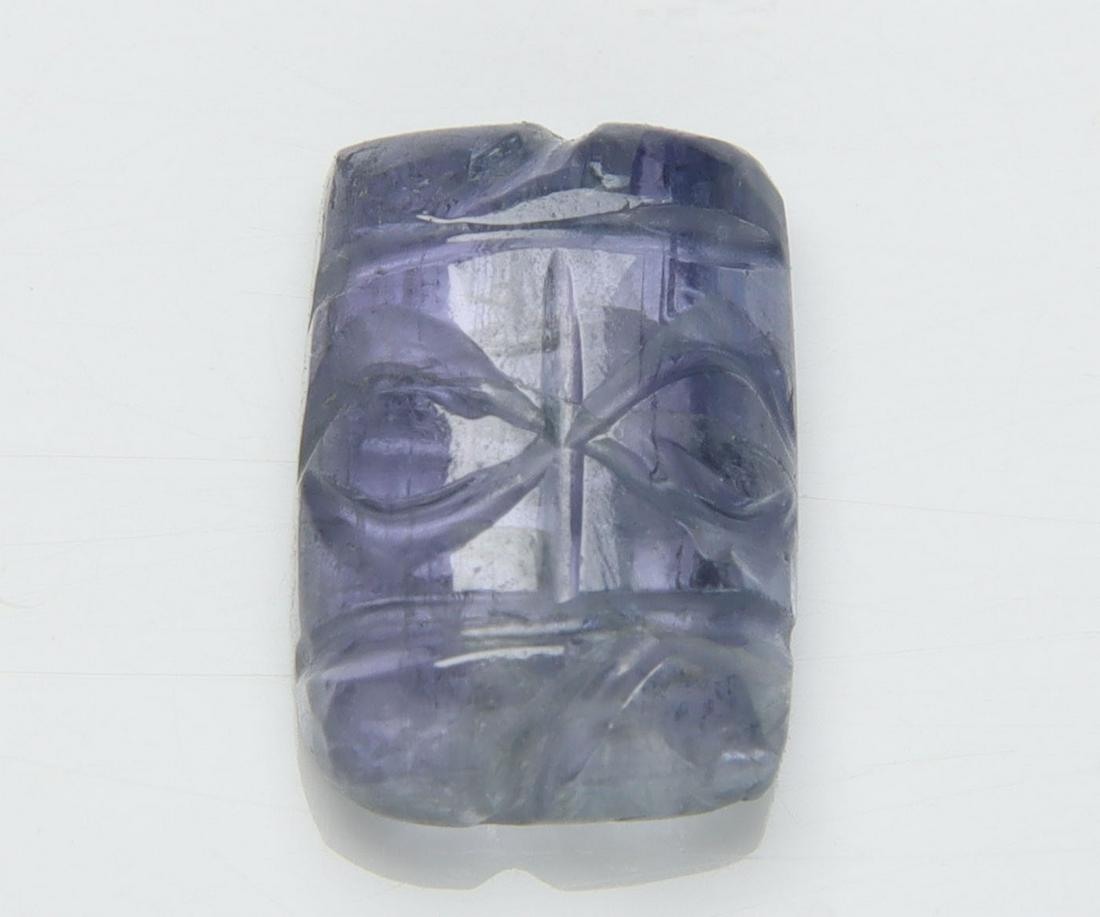 5.27 Cts Natural Tanzanite Carving: No Reserve! Title: 5.27 Cts Natural Tanzanite Carving Additional Information: Gemstone : Natural Tanzanite Carving Origin: Tanzania Weight : 5.27 carats Dimensions : 11.42x8.08x4.56 mm Shape/Cut: Rect
