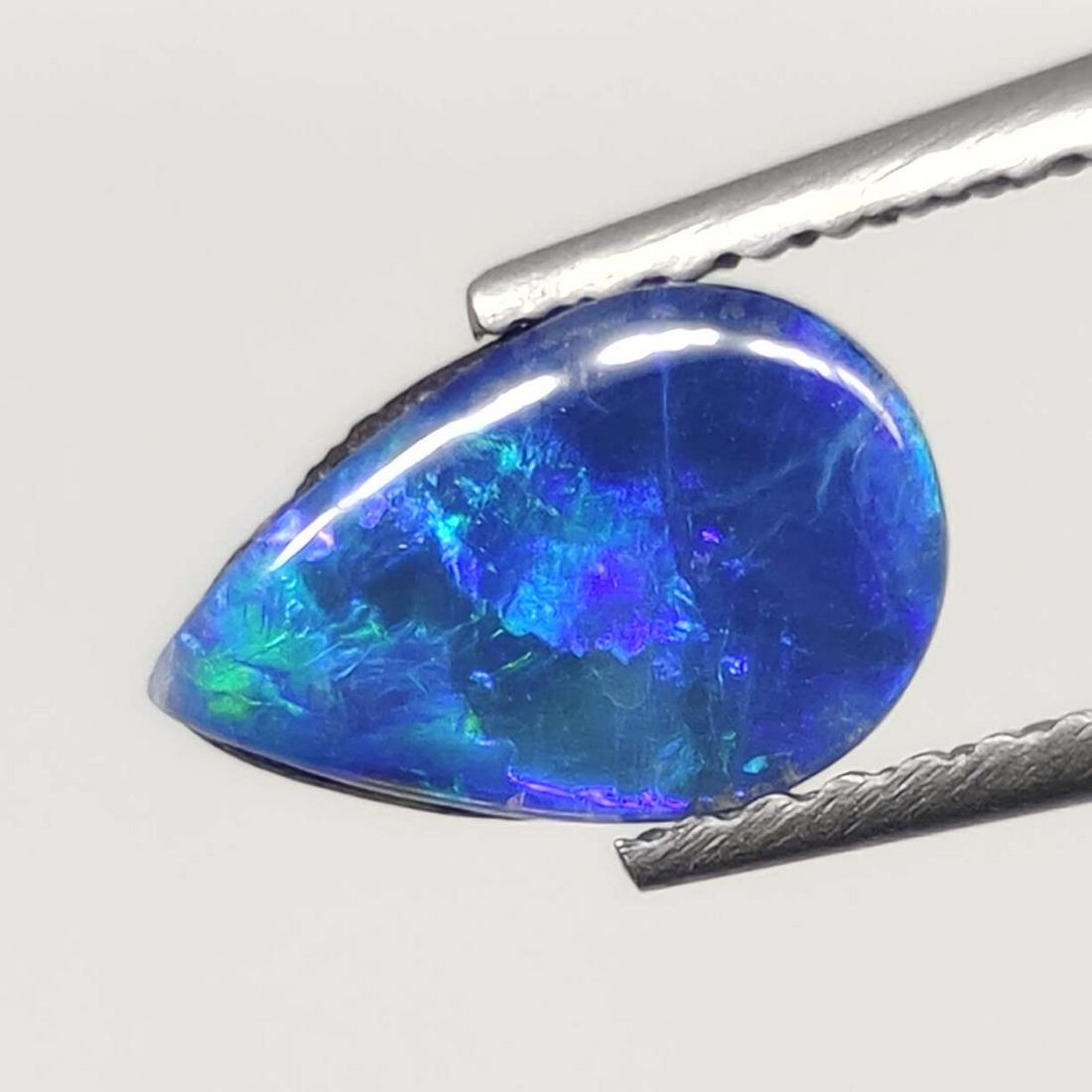 0.75 ct Australian Doublet Opal: No Reserve! Title: 0.75 ct Australian Doublet Opal Additional Information: Gemstones: Australian Doublet Opal Carat Weights: 0.75 ct Size/Dimensions: 9 X 6 mm Materials Techniques: Doublet Opal Shippi