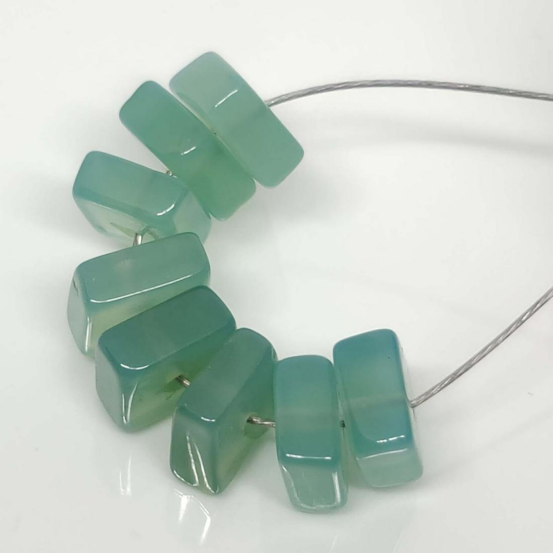5 Ct Natural Blue Chalcedony 9 Drilled Beads: No Reserve! Title: 5 Ct Natural Blue Chalcedony 9 Drilled Beads Additional Information: Gemstones: Natural Blue Chalcedony Carat Weights: 5 ct Size/Dimensions: 4 - 5.3 mm Treatment: None Materials Tec
