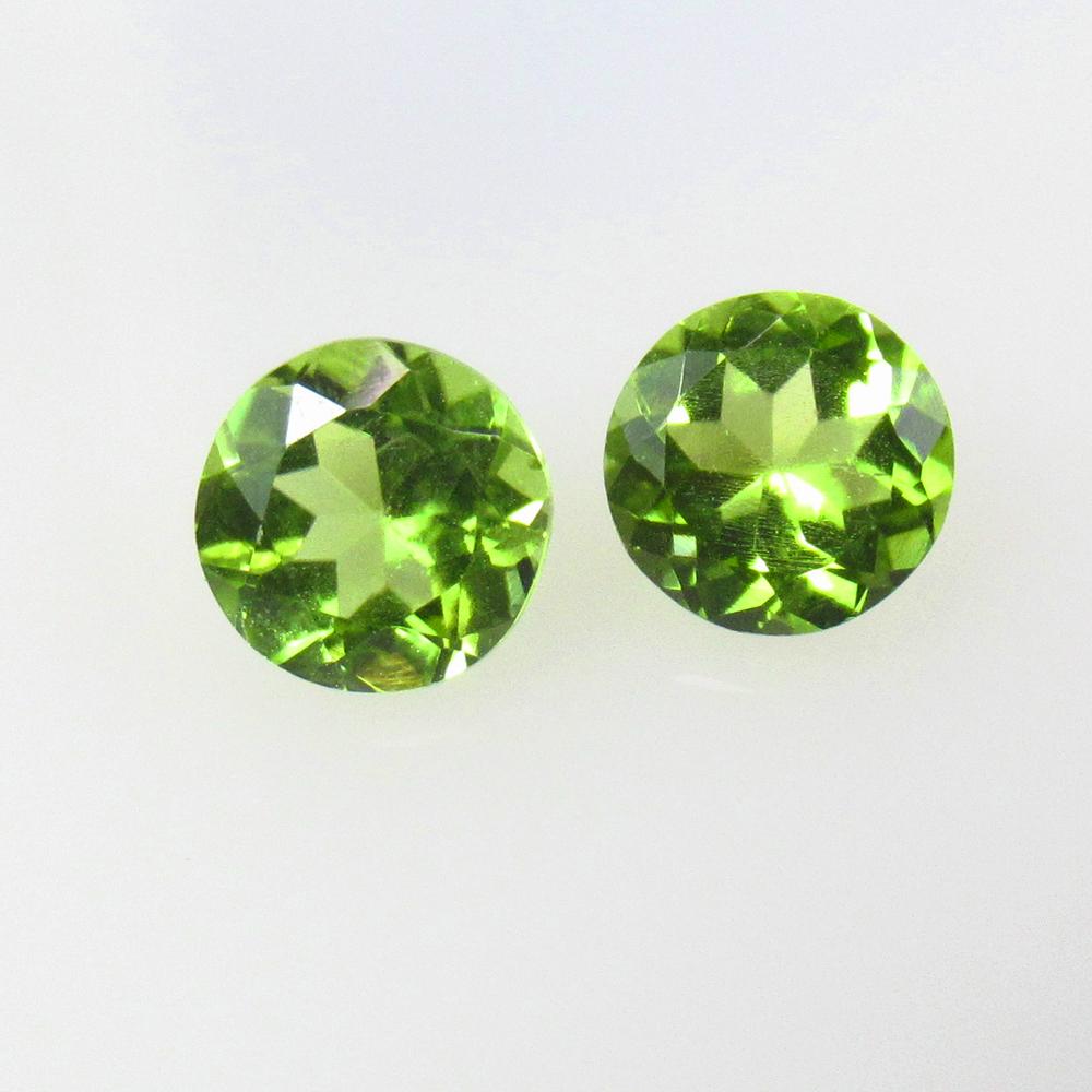 1.81 Ctw Natural Pakistan Peridot Round Pair: No Reserve! Title: 1.81 Ctw Natural Pakistan Peridot Round Pair Stone Clarity: VVS Gemstones: Natural Peridot Carat Weights: 1.81 Size/Dimensions: 6.00 x 6.00 x 3.70 mm / 2 Pc's Additional Information