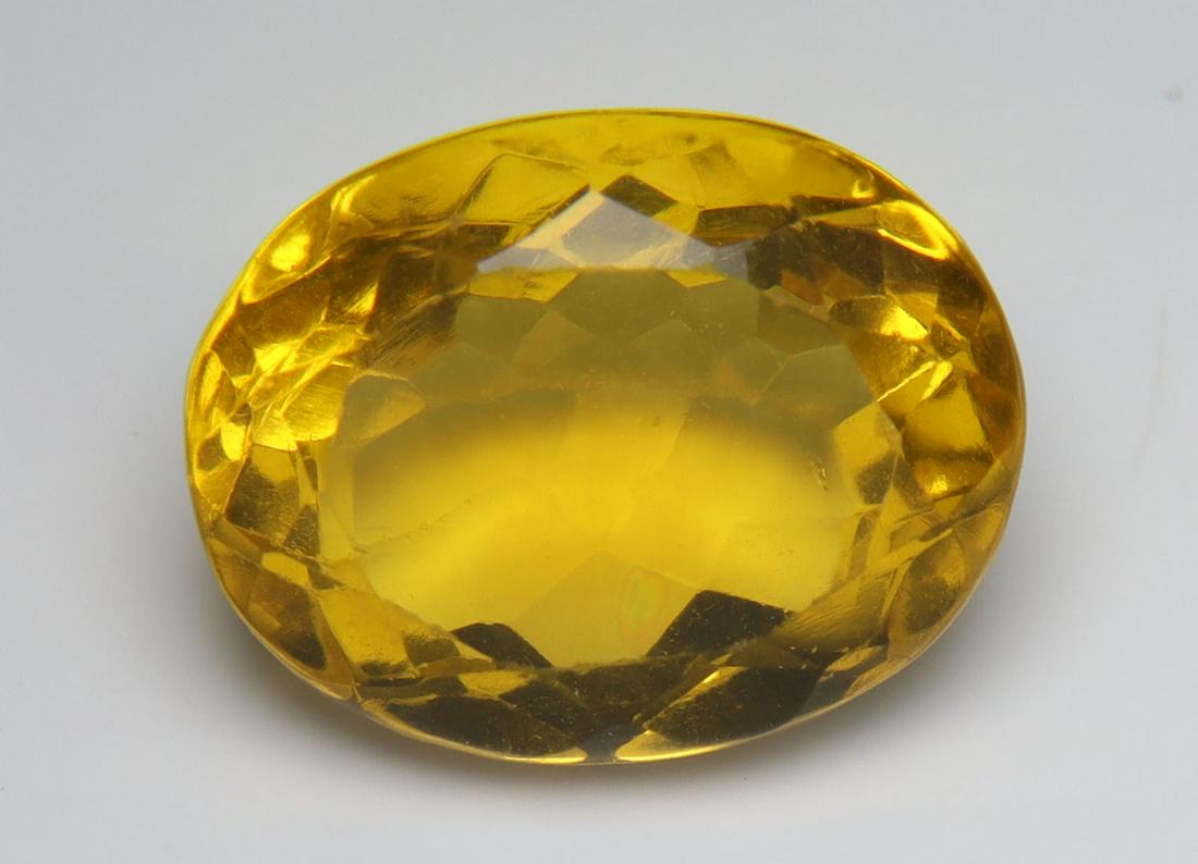 9.08 Cts Natural Yellow Fluorite: No Reserve! Title: 9.08 Cts Natural Yellow Fluorite Additional Information: Gemstone : Natural Yellow Fluorite Origin : Brazil Weight : 9.08 carats Dimensions : 13.72x10.88x7.94 mm Shape : Oval Cut Co