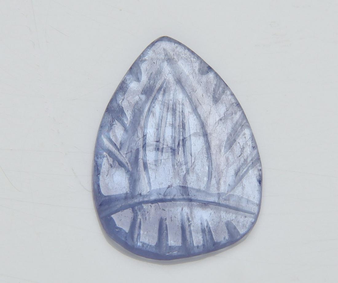 2.02 Cts Natural Tanzanite Carving: No Reserve! Title: 2.02 Cts Natural Tanzanite Carving Additional Information: Gemstone : Natural Tanzanite Carving Origin: Tanzania Weight : 2.02 carats Dimensions : 14.51x10.62x1.48 mm Shape/Cut: Pea