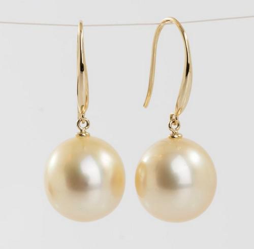 14 kt. Yellow Gold - 11x12m Golden South Sea Pearls - Earrings: Title: 14 kt. Yellow Gold - 11x12m Golden South Sea Pearls - Earrings Description: Produced by the gold-lipped Pinctada Maxima Oyster in the warm waters off the coasts of Australia, these pearls have 
