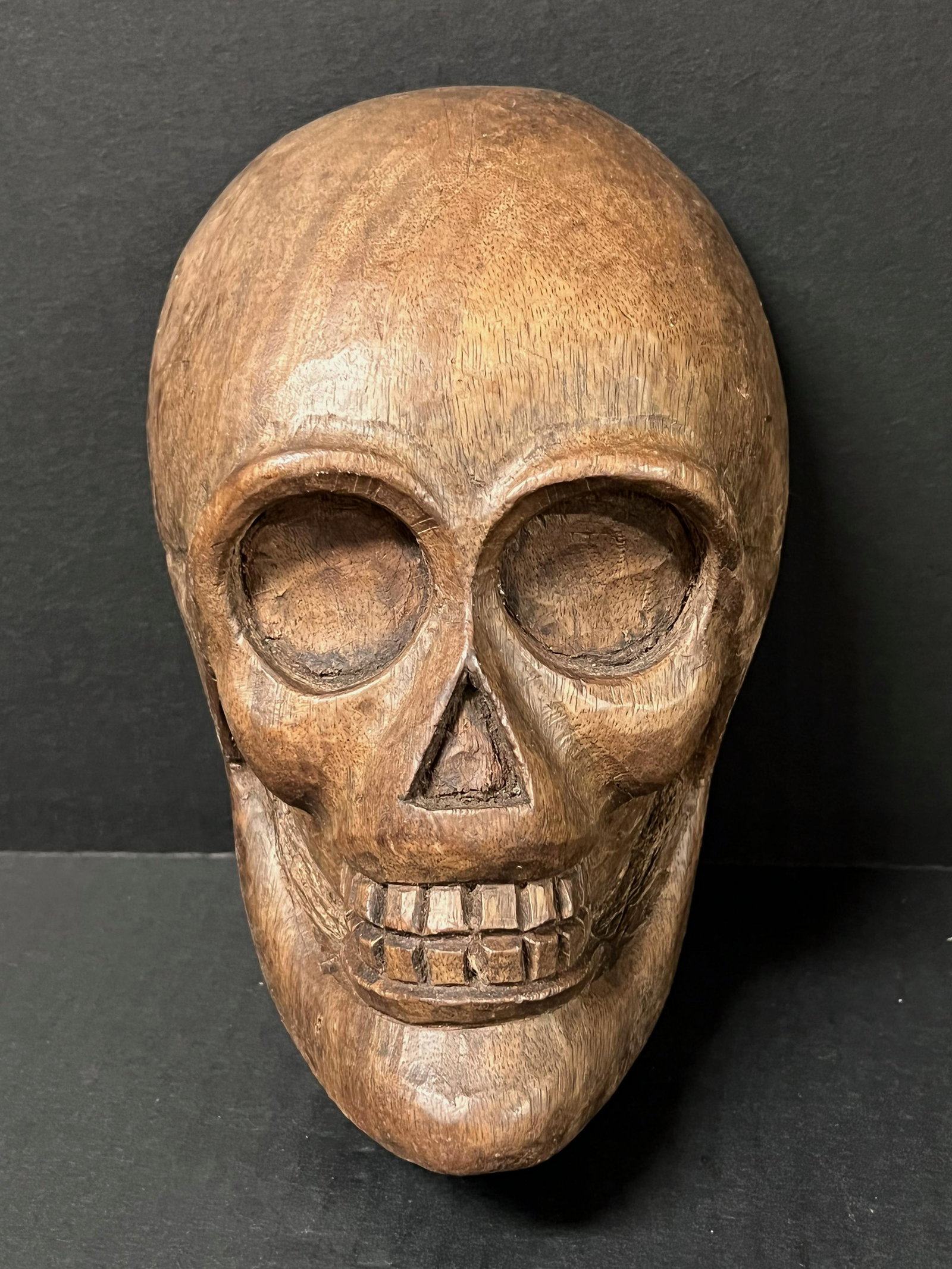 Skull Sculpture: Title: Skull Sculpture Date/Period: Late 20th Century Dimension: 8" h x 5.25" w Materials: Wood Description: Carved Wooden Skull Sculpture Reserve: $60.00 Shipping: Domestic: Flat-rate of $30.00 to an