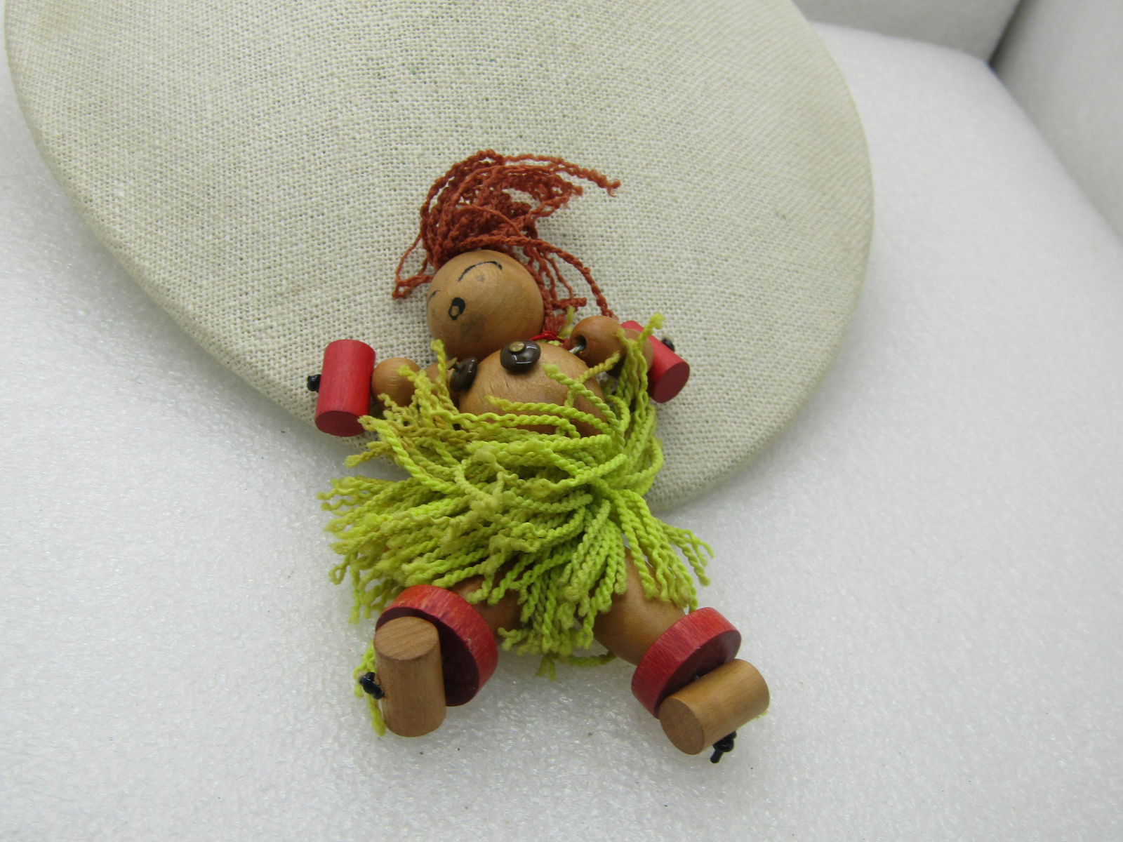 Vintage Wooden Island Hula Girl Doll Brooch, Hand Made: Vintage Wooden Island Girl Doll Brooch, Hand Made, Primitive design made from different shapes of round and barrel and disc beads in natural, lightly varnished and dyed. Brown yarn for hair and green