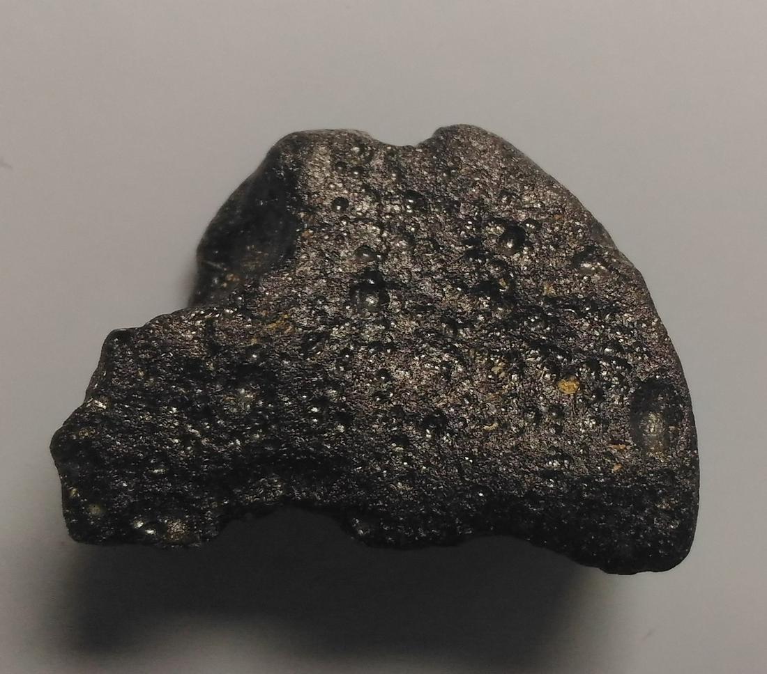 PHILIPPINITE TEKTITE - FROM METEORITE IMPACT: Title: PHILIPPINITE TEKTITE - FROM METEORITE IMPACT Origin: Paracale, Camarines Norte, Luzon, Philippines Size: 3x2.5x2 cm / 7 gram Description: flat, irregular shaped philippinite tektite with small