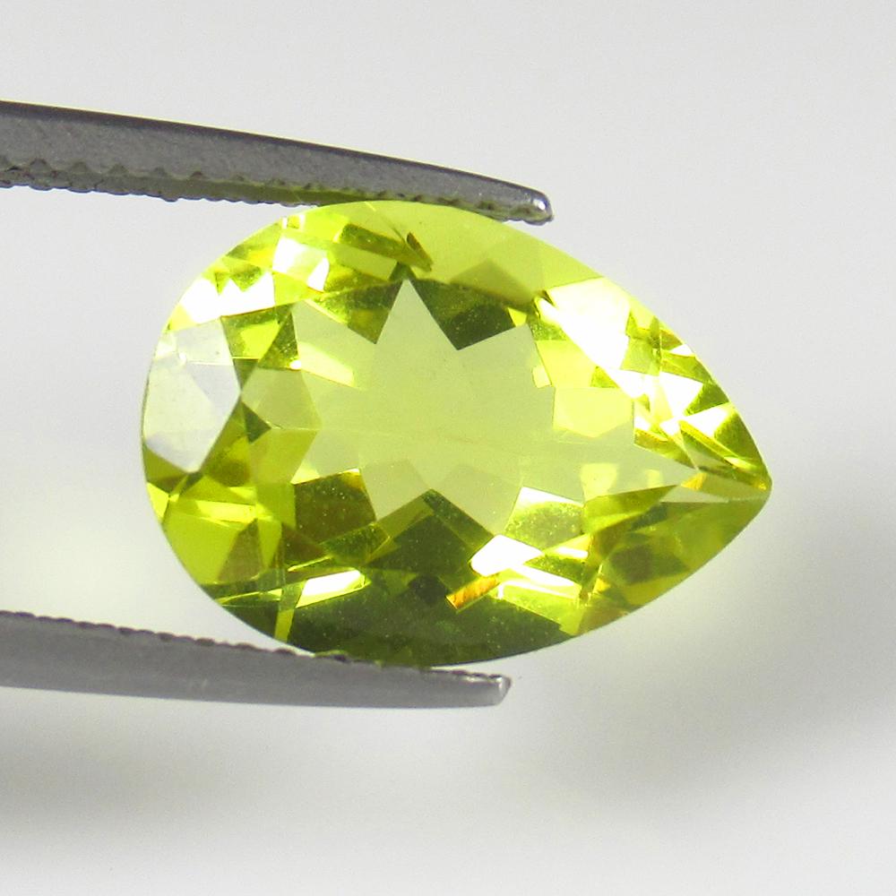 Natural Lemon Quartz - 4.96 Ct: No Reserve! Title: Natural Lemon Quartz - 4.96 Ct Origin: Brazil Weight: 4.96 Size/Dimensions: 14.0 x 10.3 x 6.4 mm Additional Information: Pieces : 1 No's / Shape : Pear Cut / Color : Greenish Yellow