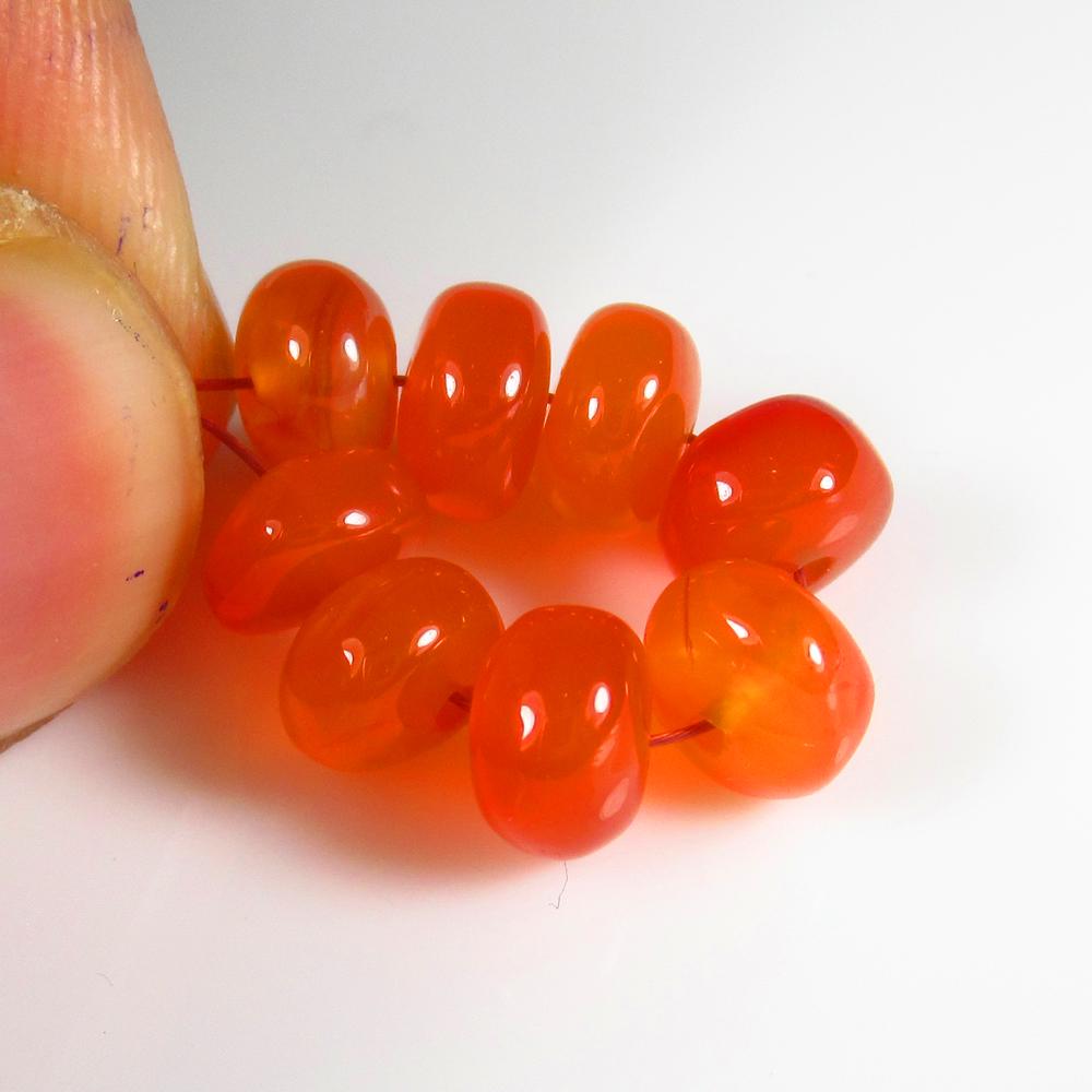 Natural Carnelian Beads - 13.21 Ct: No Reserve! Title: Natural Carnelian Beads - 13.21 Ct Origin: Brazil Weight: 13.21 Size/Dimensions: 6.8 - 7.5 mm Additional Information: Pieces : 8 No's / Shape : Drilled Round Beads / Color : Orange 