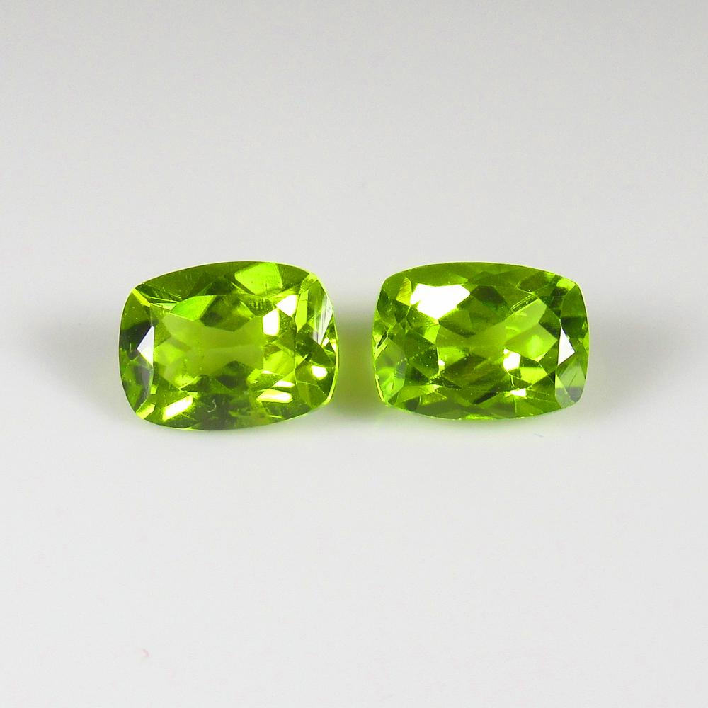 Natural Green Peridot Pair- 3.27 Ct: No Reserve! Title: Natural Green Peridot Pair- 3.27 Ct Origin: Pakistan Weight: 3.27 Size/Dimensions: 8.2 x 6.3.x 4.3 mm Additional Information: Pieces : 2 No's / Shape : Cushion Cut / Color : Green /