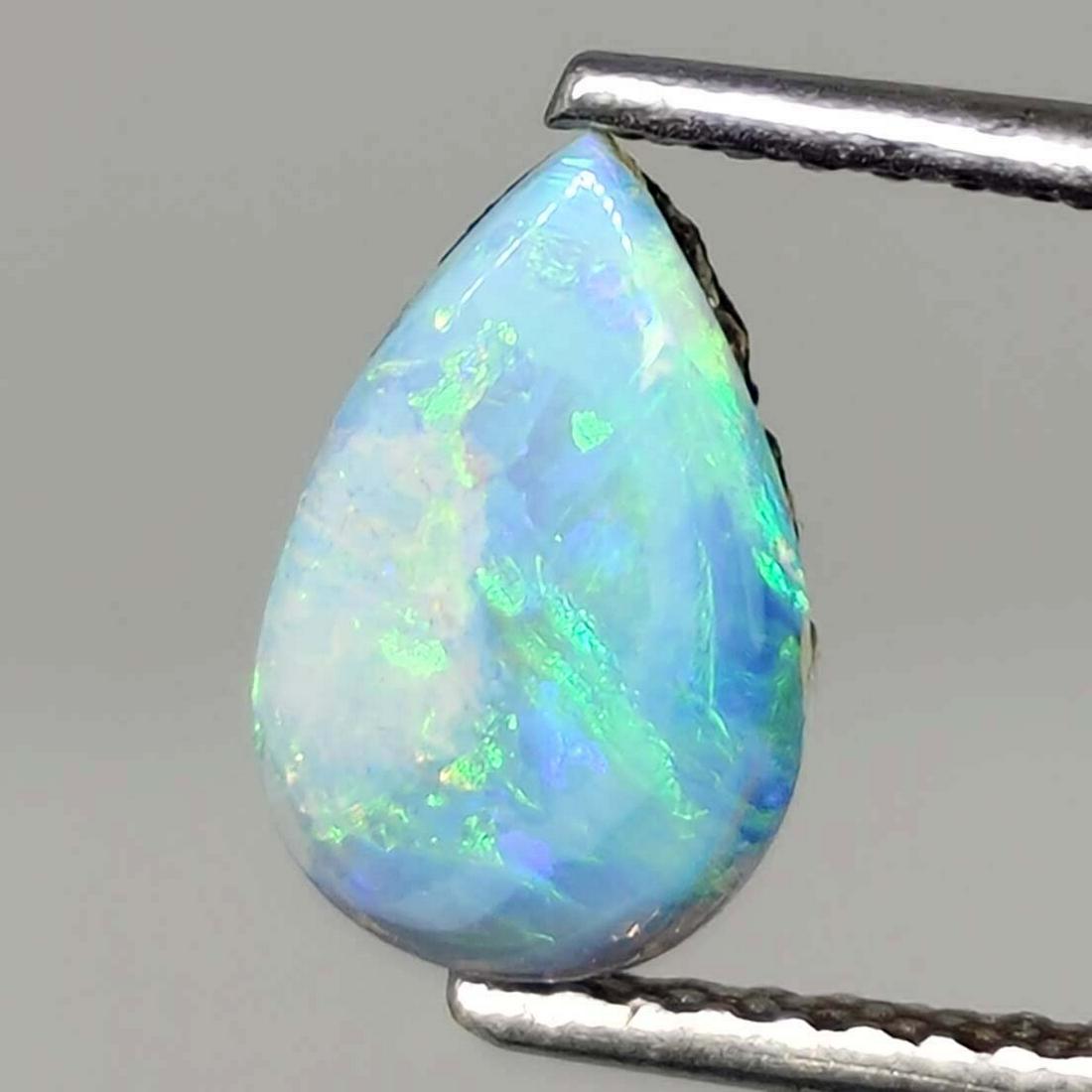 0.90 ct Australian Doublet Opal: No Reserve! Title: 0.90 ct Australian Doublet Opal Additional Information: Gemstones: Australian Doublet Opal Carat Weights: 0.90 ct Size/Dimensions: 9 X 6 mm Materials & Techniques: Opal Shipping: Do