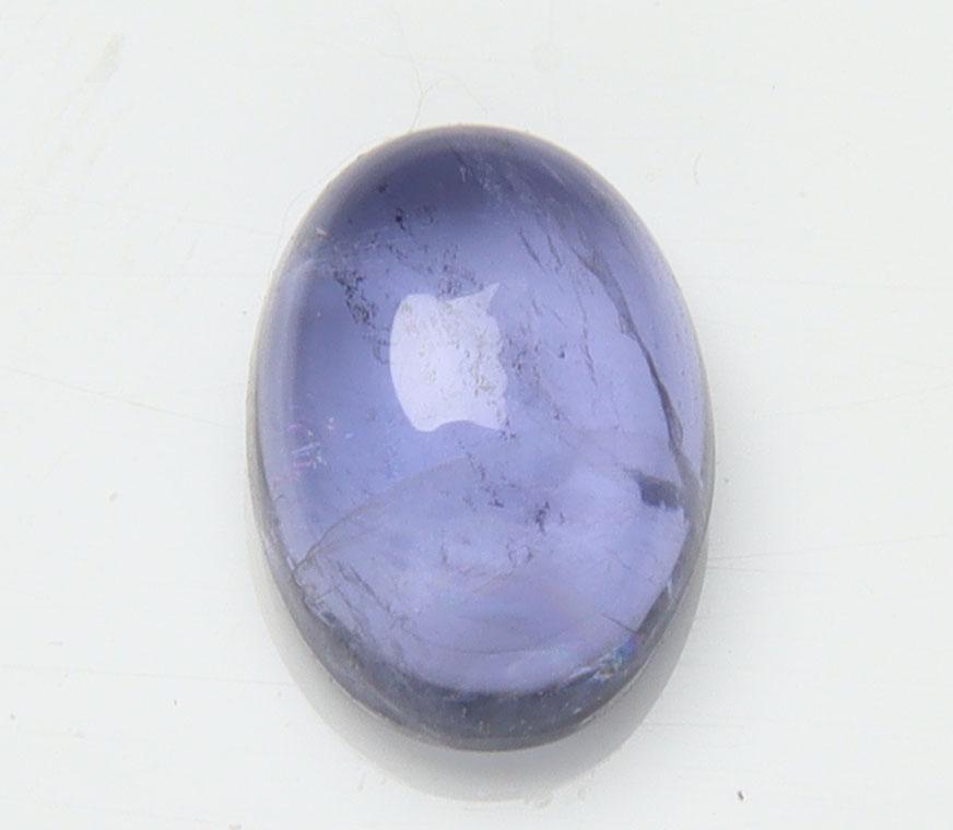 1.16 cts Natural Iolite: No Reserve! Title: 1.16 cts Natural Iolite Additional Information: Gemstone : Natural Iolite Shape and cut : Oval Cabochan Weight : 1.16 carats Measurements : 7.40x5.48x3.68 mm , Color : Violite Trans