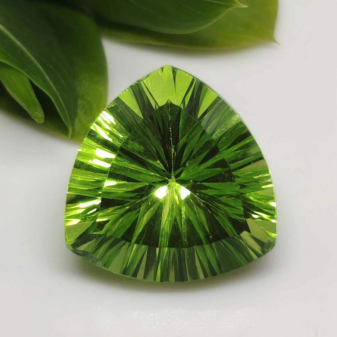 6.50 ct Rare Chartreuse Mystic Quartz: No Reserve! Title: 6.50 ct Rare Chartreuse Mystic Quartz Additional Information: Gemstones: Natural Mystic Quartz Carat Weights: 6.50 ct Size/Dimensions: 12 X 12 mm Treatment: Coated Materials & Techn