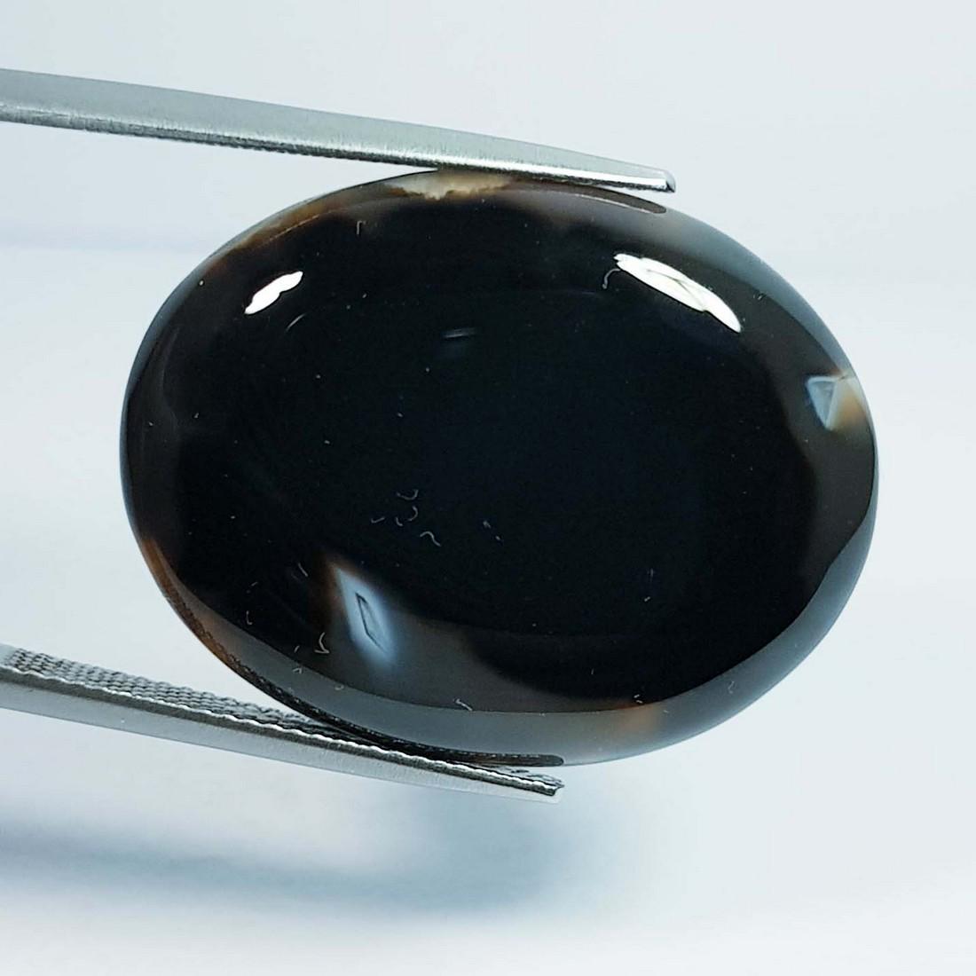 28.38 Ctz Natural Black Lace Agate: No Reserve! Title:28.38 Ctz Natural Black Lace Agate Color/Clarity:Semi Transparent Gemstones:Agate Carat Weights:28.38 Size/Dimensions:28.70 x 22.35 x 5.10 Additional Information:Oval / Brazil Shippi