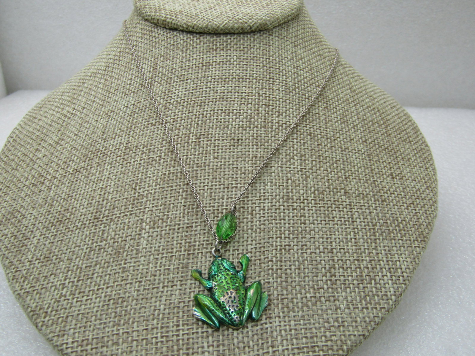 Vintage Sterling Green Enameled Frog Necklace, 18": Vintage Sterling Green Enameled Frog Necklace, 18", 4.94 grams. 1" green foil enameled fog with a green crystal bead, 1.5" with bead and frog. Frog is appx. 1" tall and wide. Chain is a rope chain, 18