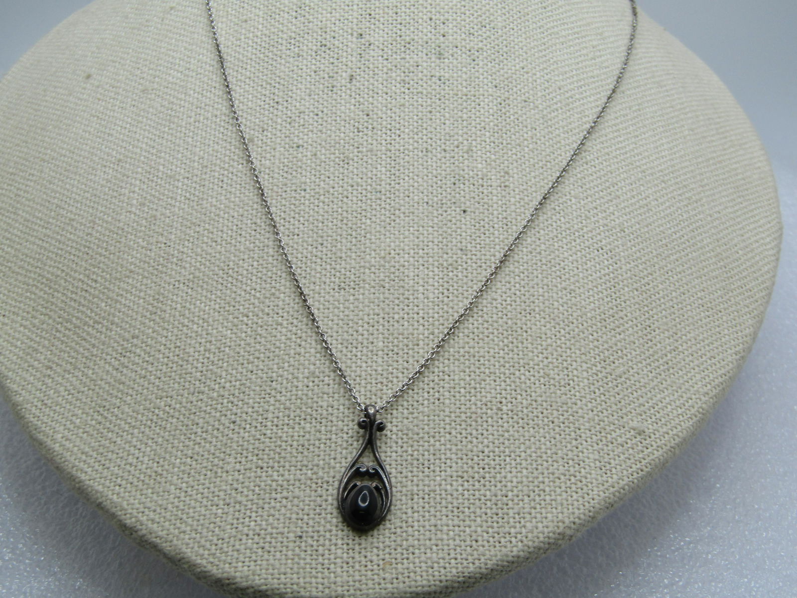 Vintage Sterling Obsidian Glass Necklace, 18" Chain, 1960's-1970's: Vintage Sterling Obsidian Glass Necklace, 18" Chain, 1960's-1970's. It is marked sterling and has a copyright symbol. The penpdant is sterling - the chain does not test as sterling. The pendant is a s