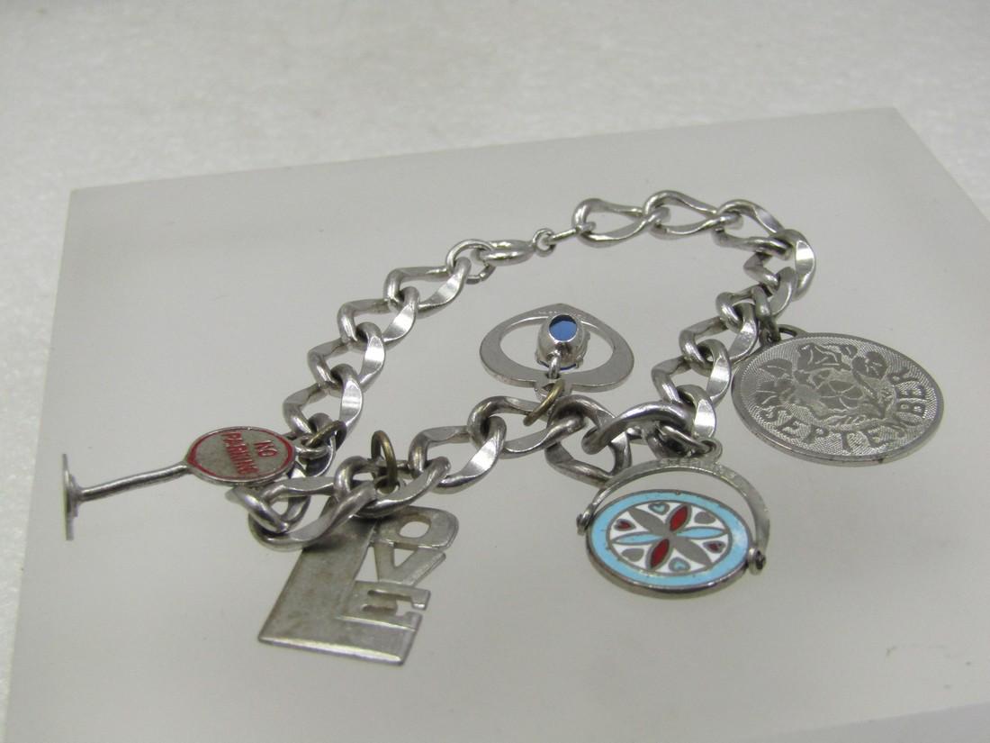 Vintage Sterling Silver Charm Bracelet, 7", 5 Charms, 1970's, Love & More: Vintage Sterling Silver Charm Bracelet, 7", 5 Charms, 1970's, Love & More. 1970's. Stome charms are marked and signed and some not - No parking sign, enameled with red lettering is not marked or signe