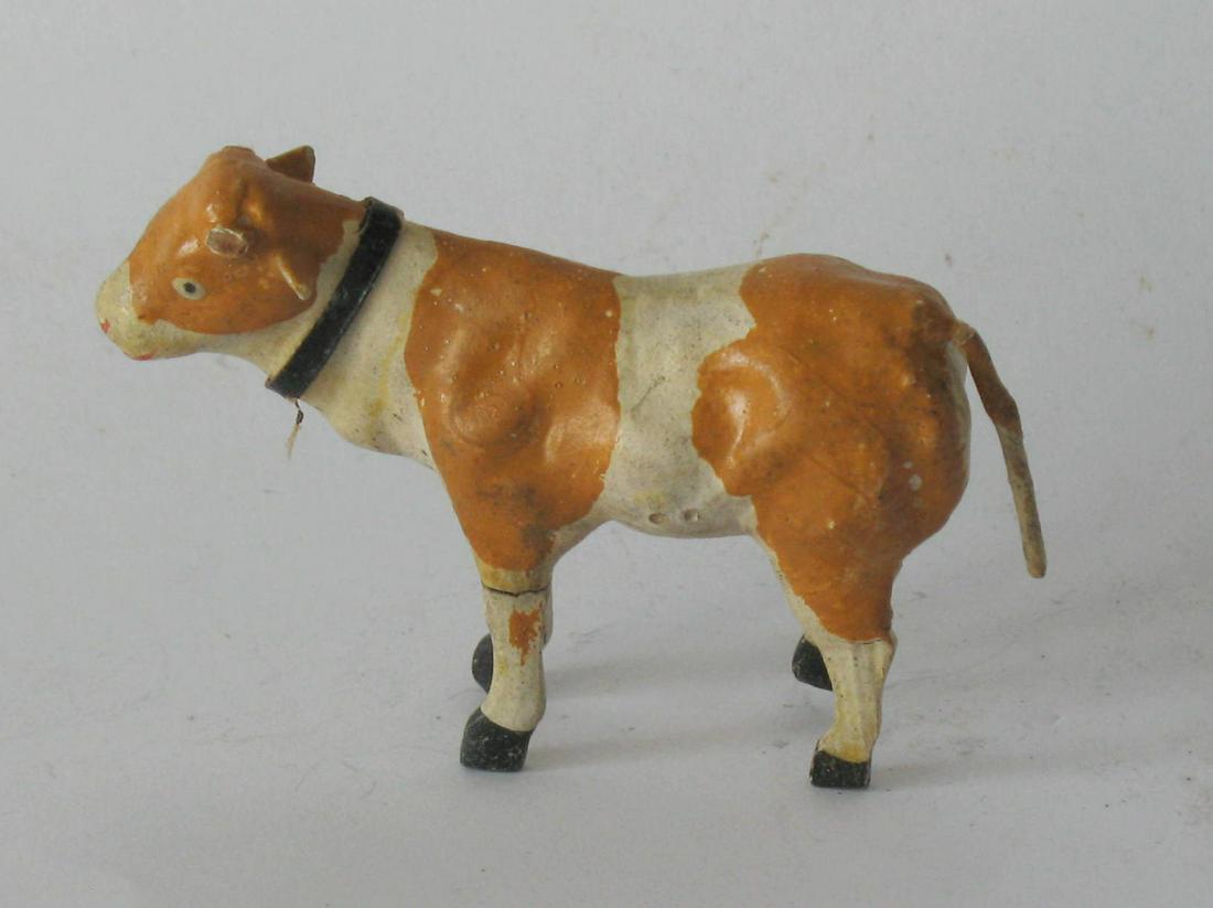 Antique composition Putz stick leg cow.: Title: Antique composition Putz stick leg cow. Date/Period: 1920's Dimension: 2” x 3” Additional Information: Nice antique composition Putz stick leg cow made in Germany in great original 