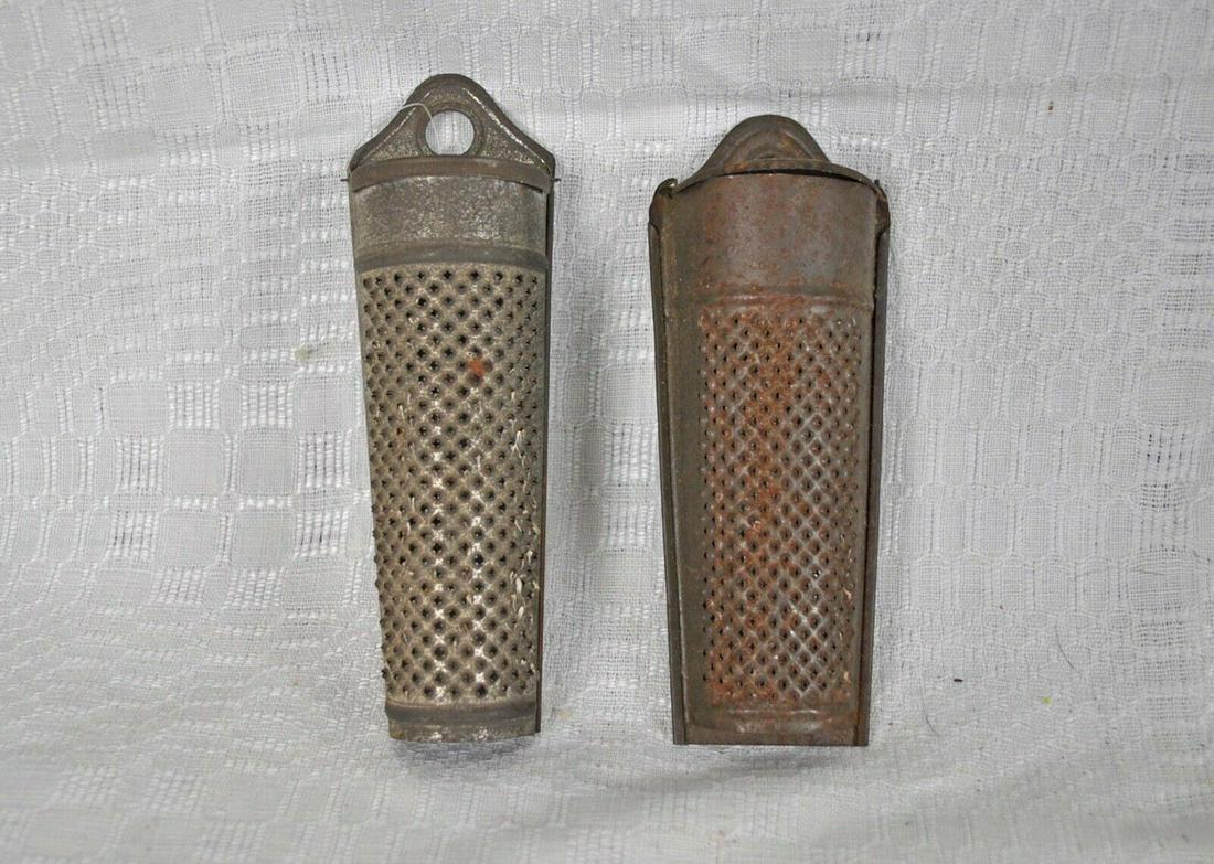 Vintage Tin Nutmeg Spice Graters, Lot Of 2: Vintage Nutmeg Spice Grater, Lot of 2 Presenting two tinned metal hanging nutmeg graters dating from the 1920s to 1940s. It also has enclosed storage area for the catching of the grated nutmeg. Both h
