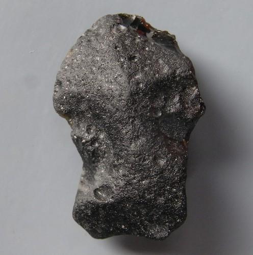 PHILIPPINITE TEKTITE - FROM METEORITE IMPACT: Title: PHILIPPINITE TEKTITE - FROM METEORITE IMPACT Origin: Paracale, Camarines Norte, Luzon, Philippines Size: 1.5x1.5x1 cm / 10 gram cubic smooth philippinite tektitet Reserve: $10.00 Shipping: Dome