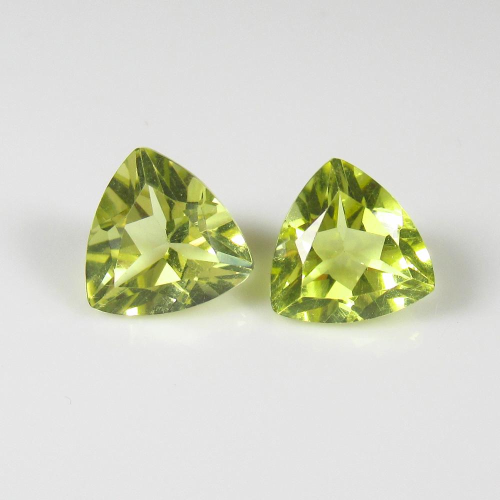 Natural Lemon Quartz Pair - 3.02 Ct: No Reserve! Title: Natural Lemon Quartz Pair - 3.02 Ct Origin: Africa Weight: 3.02 Size/Dimensions: 8.0 x 8.0 x 3.8 mm Additional Information: Pieces : 2 No's / Shape : Trillion Cut / Color : Greenish