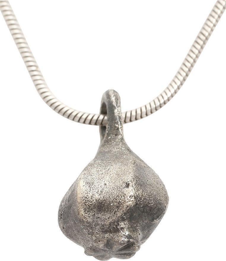 ROMAN SILVERED NECKLACE, 1ST-3RD CENTURY AD: Silvered bronze, 5/8” height, tear-shaped and hexagonal section resulting in faceted sides. The bottom with a circle divided into six segments, a reference to the Rota Fortuna (Wheel of Fortune)