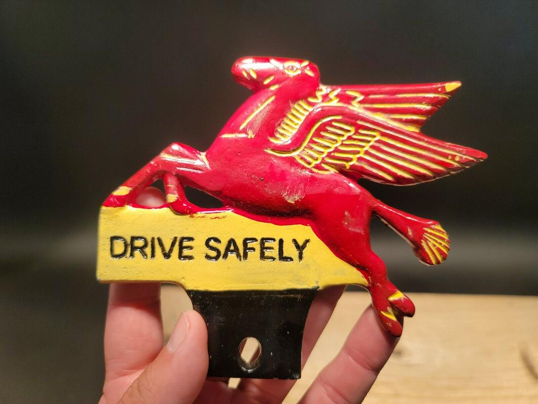 Aluminum Pegasus Drive Safely License Plate Fob Topper: 5" tall x 6" wide Wonderful reproduction license plate topper. Good detail aluminum, slightly aged to look like an antique. Certainly hard to tell its age. Reserve: $25.00 Shipping: Domestic: Flat-rat