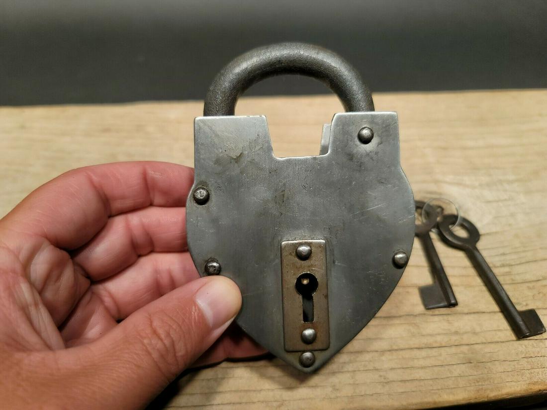 Cast Iron Steel Heart Bridge Padlock Lock & Key: 5" tall x 3 1/4" Wide Nice reproduction heart shaped cast iron and steel padlock! This lock is fully functional! Hard to tell its age. Heavy iron and brass. Great aged patina throughout. Limited quant