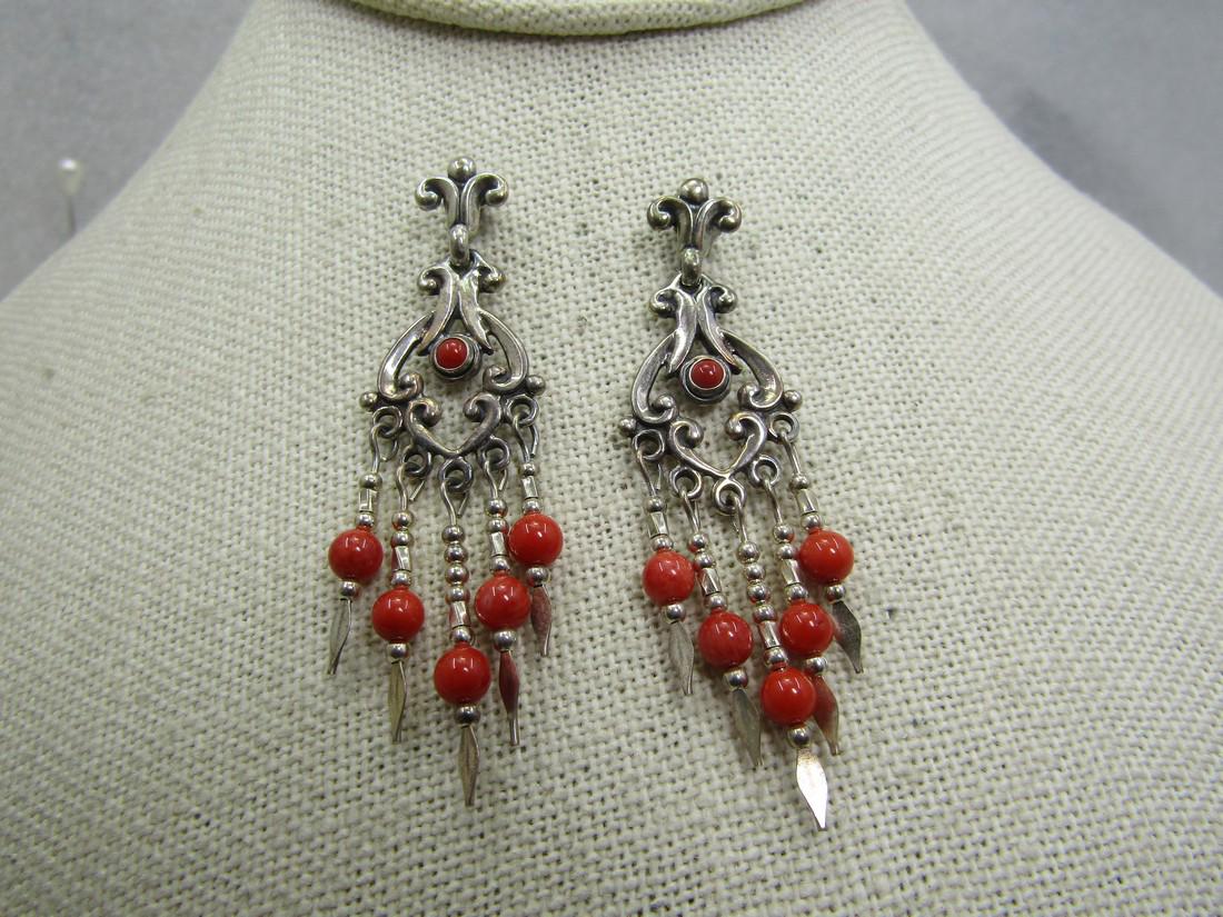 Vintage Sterling Southwestern Red Coral Drop Earrings, Sigined QTC: Vintage Sterling Southwestern Red Coral Drop Earrings, Sigined QTC. They have a scrolled stud and from that drops a decorative scrolled dsign with a center red coral that is bezel-set and then five st
