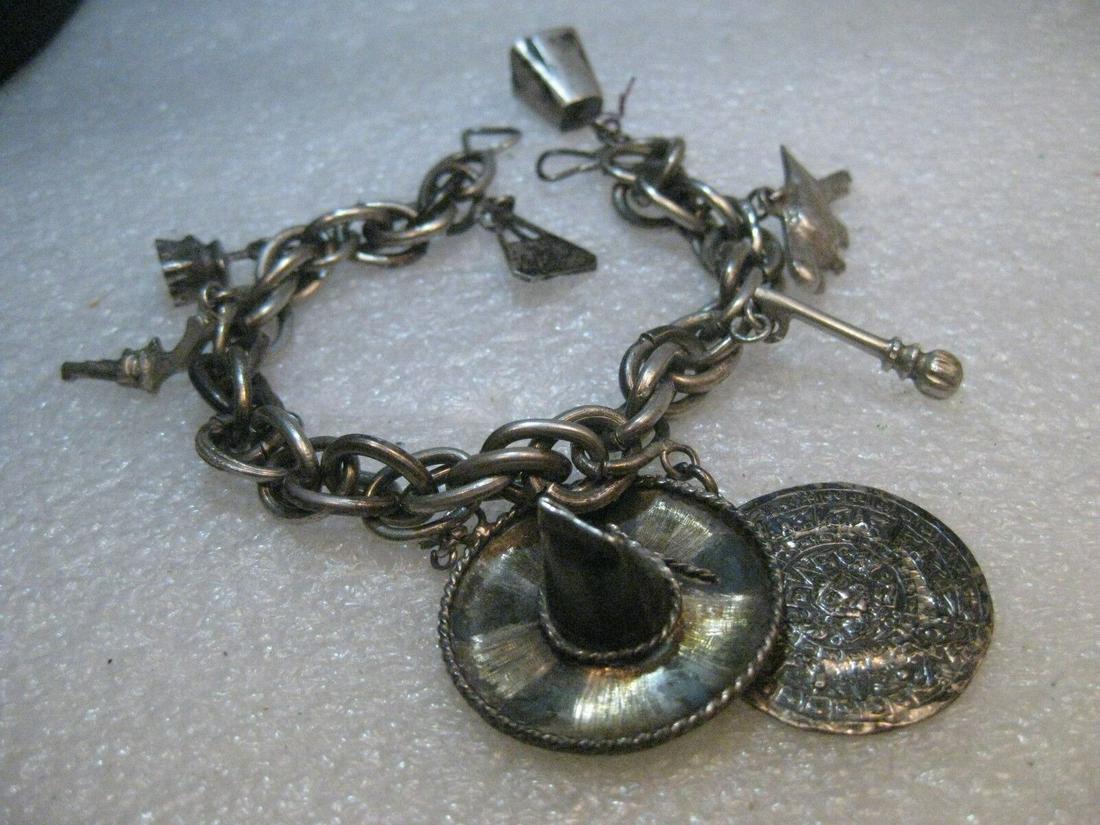 Vintage Sterling Silver Mexican Charm Bracelet, Ethnic Charms, 7", 1930's-1950's: Vintage 1940's-1950's sterling silver charm bracelet, heavy multi-link spiral bracelet, 7", 45.35 grams - Mexico/Aztec. This is a heavy 8mm wide spiral chunky link bracelet. It has eight Aztec/Mexican