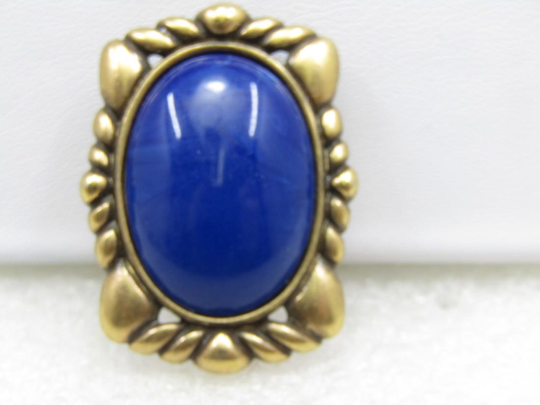Vintage Monet Blue Stone Rectangular Brooch, 1-3/8" by 1".: Vintage Monet Blue Stone Rectangular Brooch, 1-3/8" by 1". It has a cameo design to it with an oval blue lucite stone that is bezel-set with a frame around the stone. Signed Money SIGN , age is appx.