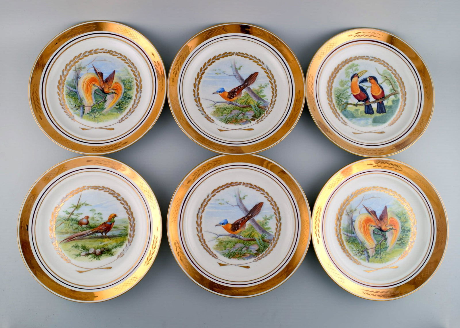 Royal Copenhagen. Set of six large dinner / decoration plates with hand painted bird motifs. Dated (1 of 6)