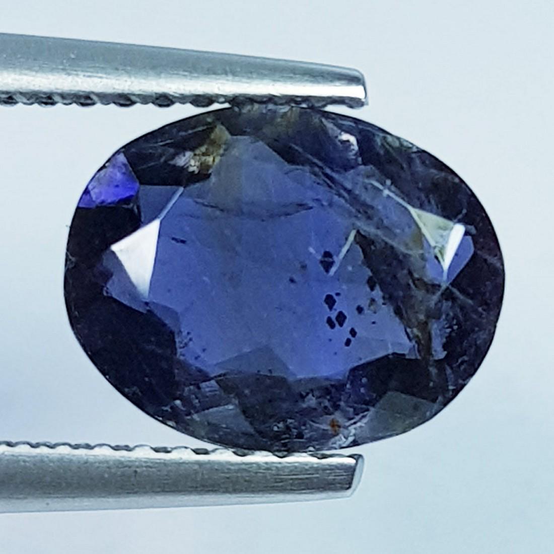 1.71 Ctz "Fine Collection" Natural Iolite Oval Cut: No Reserve! Title: 1.71 Ctz "Fine Collection" Natural Iolite Oval Cut Color/Clarity: Blue / VS Gemstones: Lolite Carat Weights: 1.71 Size/Dimensions: 9.70 x 7.60 x 3.80 Additional Information: Oval -