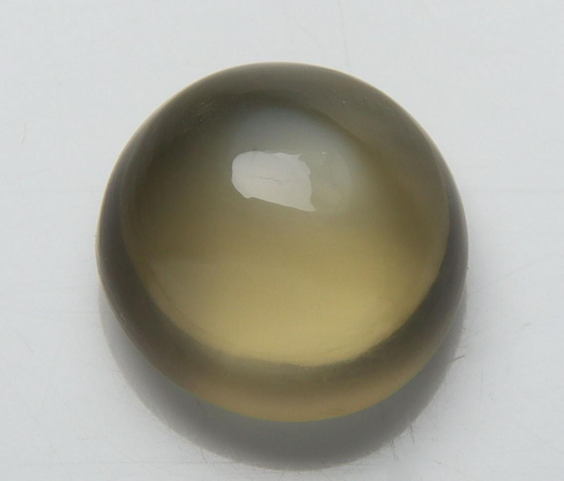 Unique Color 4.48 Cts Natural Greenish Browm Moonstone: No Reserve! Title: Unique Color 4.48 Cts Natural Greenish Browm Moonstone Additional Information: Gemstone : Natural Green Moonstone Shape : Round Cabochan Weight : 4.48 carats Measurements : 10.44-10