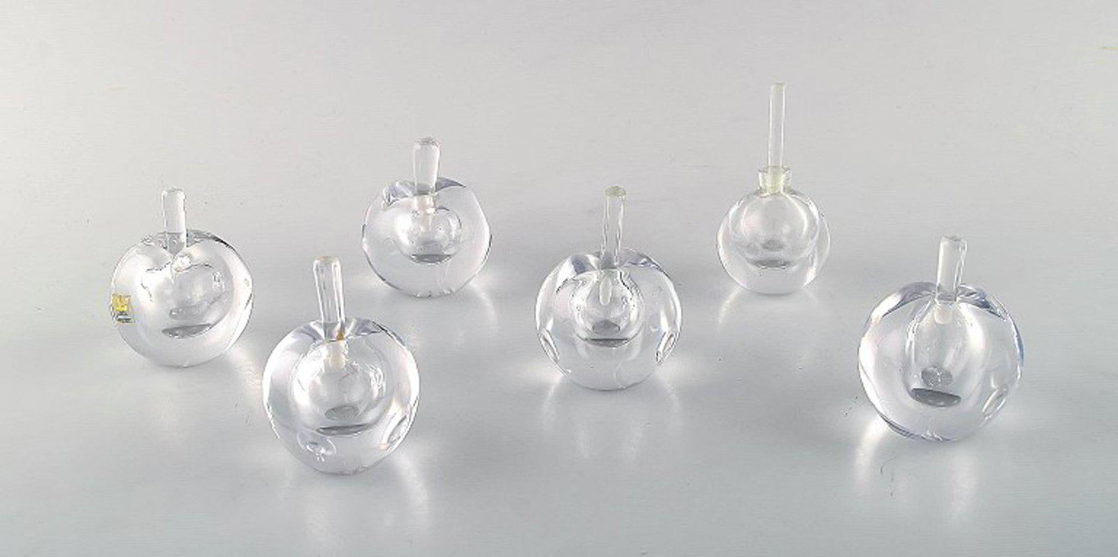 Vicke Lindstrand for Kosta Boda. A collection of six mouth blown perfume bottles in clear art glass.: Title: Vicke Lindstrand for Kosta Boda. A collection of six mouth blown perfume bottles in clear art glass. Designed in the 1960s. Description: Vicke Lindstrand for Kosta Boda. A collection of six mou