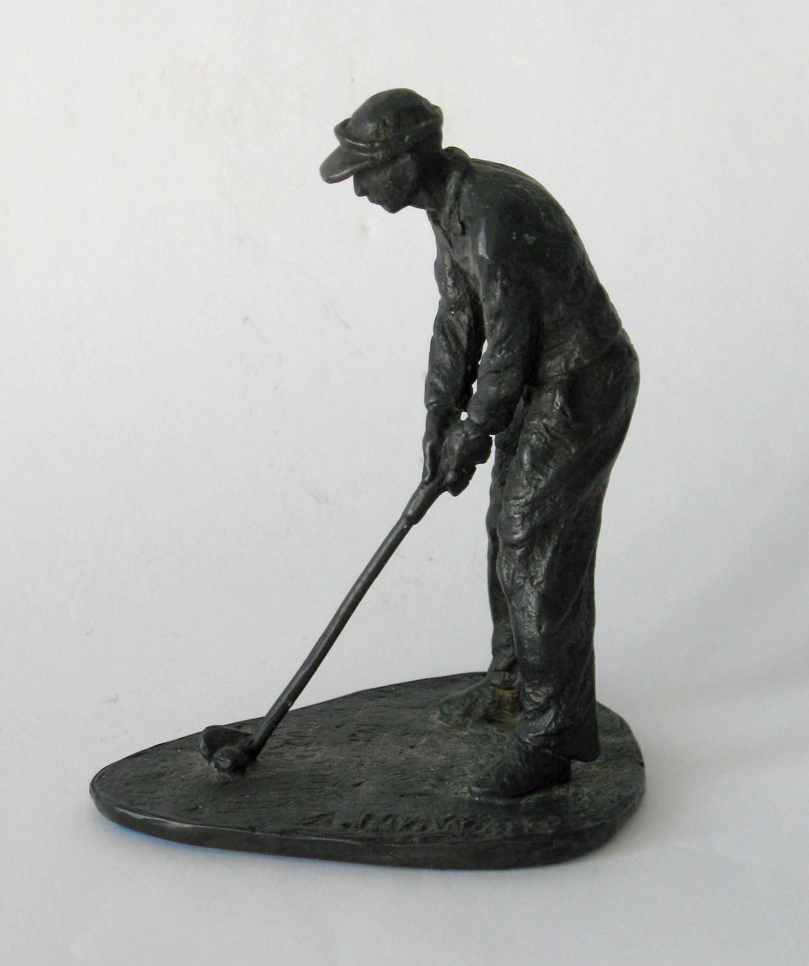 Vintage cast metal golfer paper weight signed. (1 of 3)