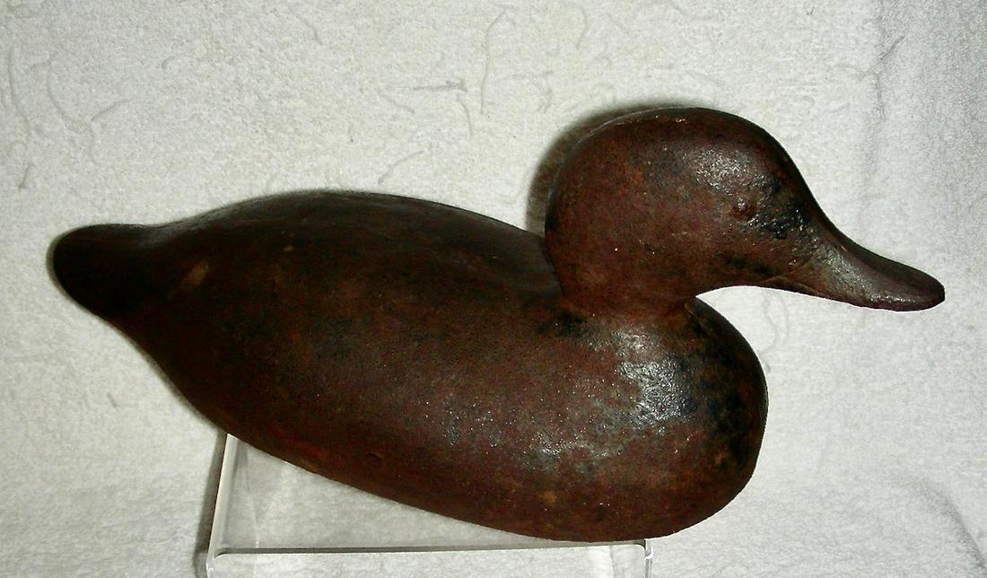 Iron Sink Box Duck Decoy c.1900: A cast iron Sink Box Duck Decoy dating to the very early 20th century, or a bit older. These iron decoys were used as ballast on sink boxes or punt boats that were used for hunting waterfowl. The boat