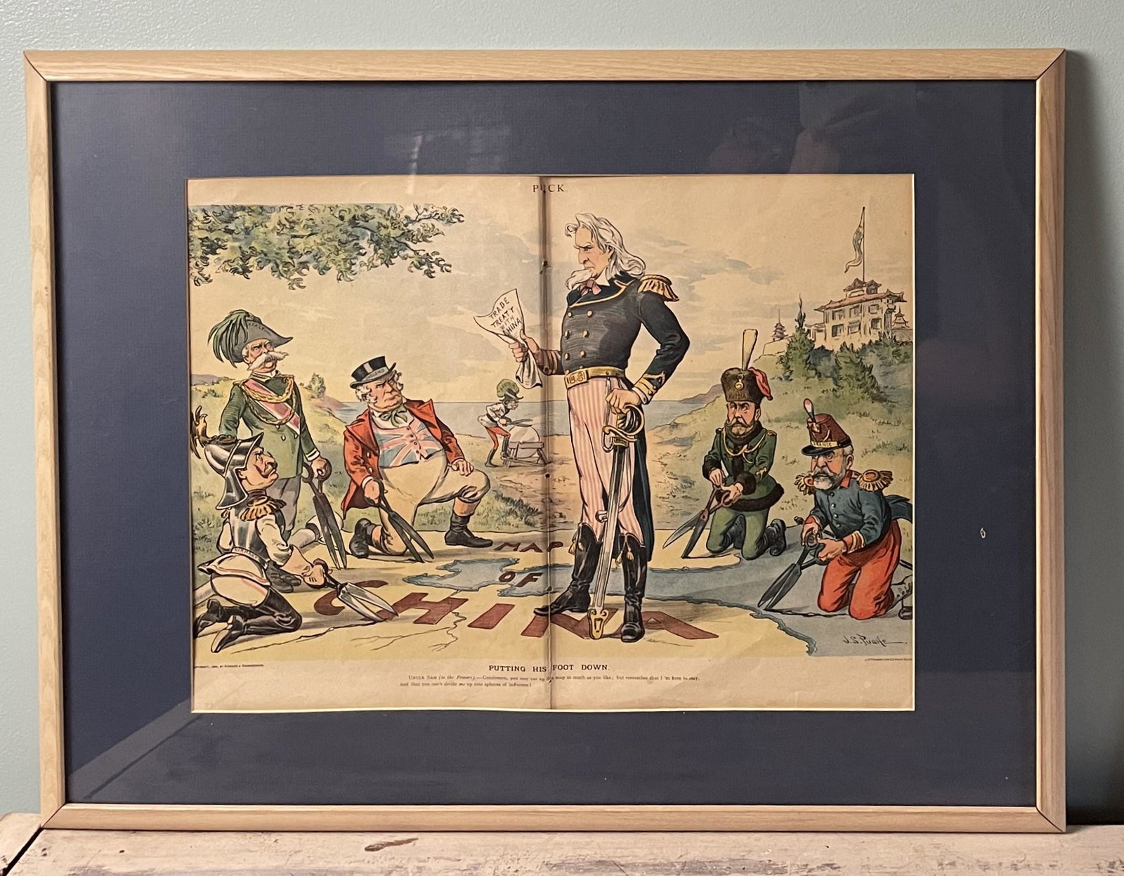 1899 POLITICAL SATIRE COVER OF PUCK MAGAZINE "PUTTING HIS FOOT DOWN" FRAMED: Title: 1899 POLITICAL SATIRE COVER OF PUCK MAGAZINE "PUTTING HIS FOOT DOWN" FRAMED Date/Period: 1899 Dimension: framed size 21.75 x 25 Material: MIXED MATERIALS Additional Information: 1900 POLITICAL 
