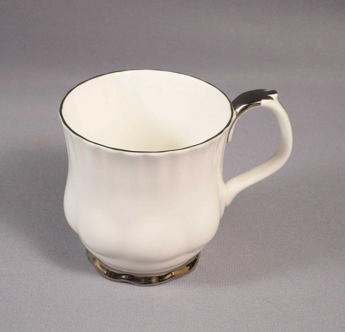 Royal Albert CHANTILLY Montrose COFFEE TEA MUG White Silver Platinum: This is a gorgeous Bone China Tea/Coffee mug from the famous Chantilly collection by Royal Albert - Made in England. The rims of this pattern with hand-applied bands of platinum rim on snow white back
