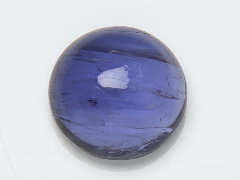 1.42 cts Natural Iolite: No Reserve! Title: 1.42 cts Natural Iolite Additional Information: GGemstone : Natural Iolite Shape and cut : Round Cabochan Weight : 1.42 carats Measurements : 7.46-7.44x3.63 mm , Color : Violite Tra