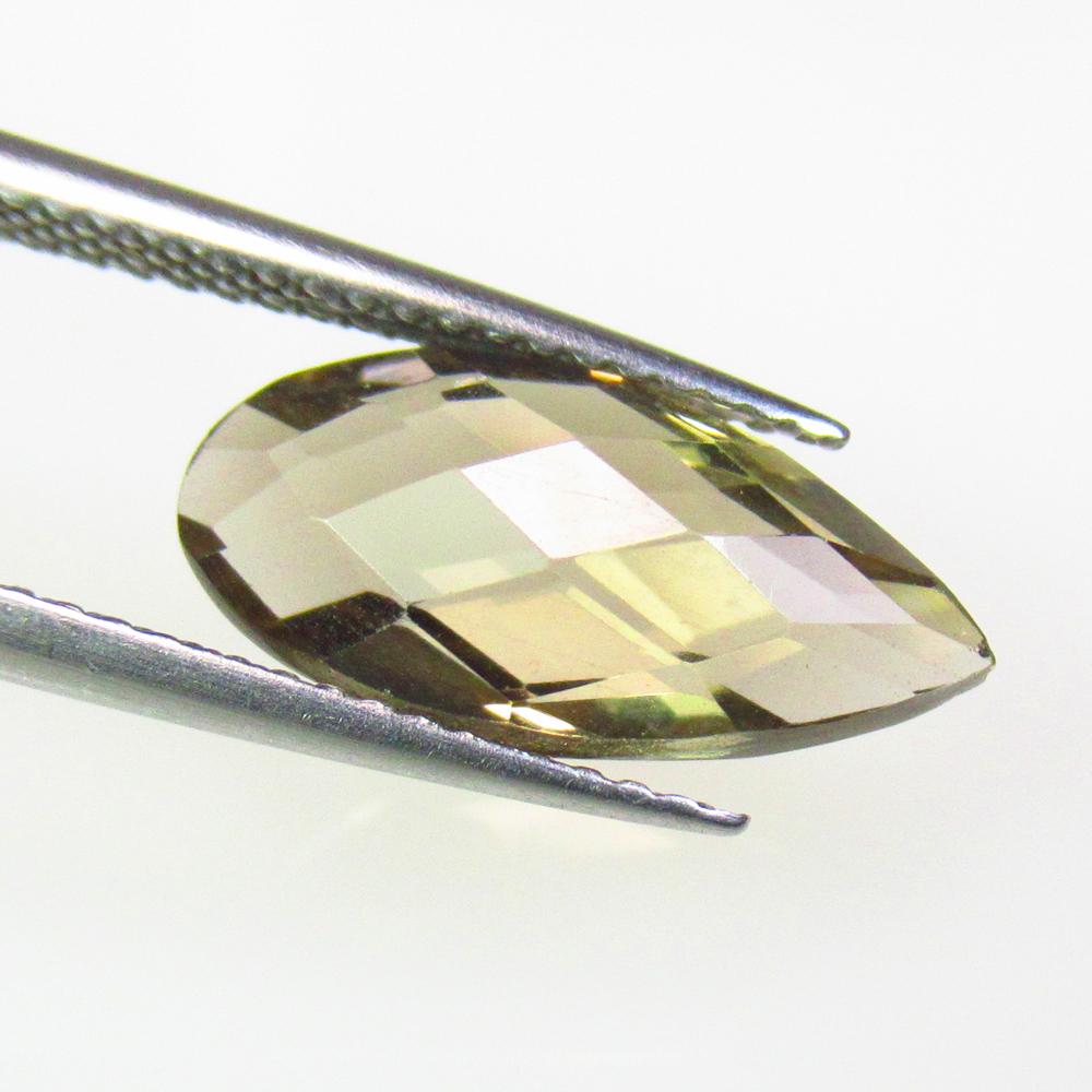 3.30 Ctw Natural Smoky Quartz Pear Checkerboard Cut: No Reserve! Title: 3.30 Ctw Natural Smoky Quartz Pear Checkerboard Cut Stone Clarity: VVS Gemstones: Natural Smoky Quartz Carat Weights: 3.3 Size/Dimensions: 15.00 x 7.20 x 5.10 mm Additional Informat