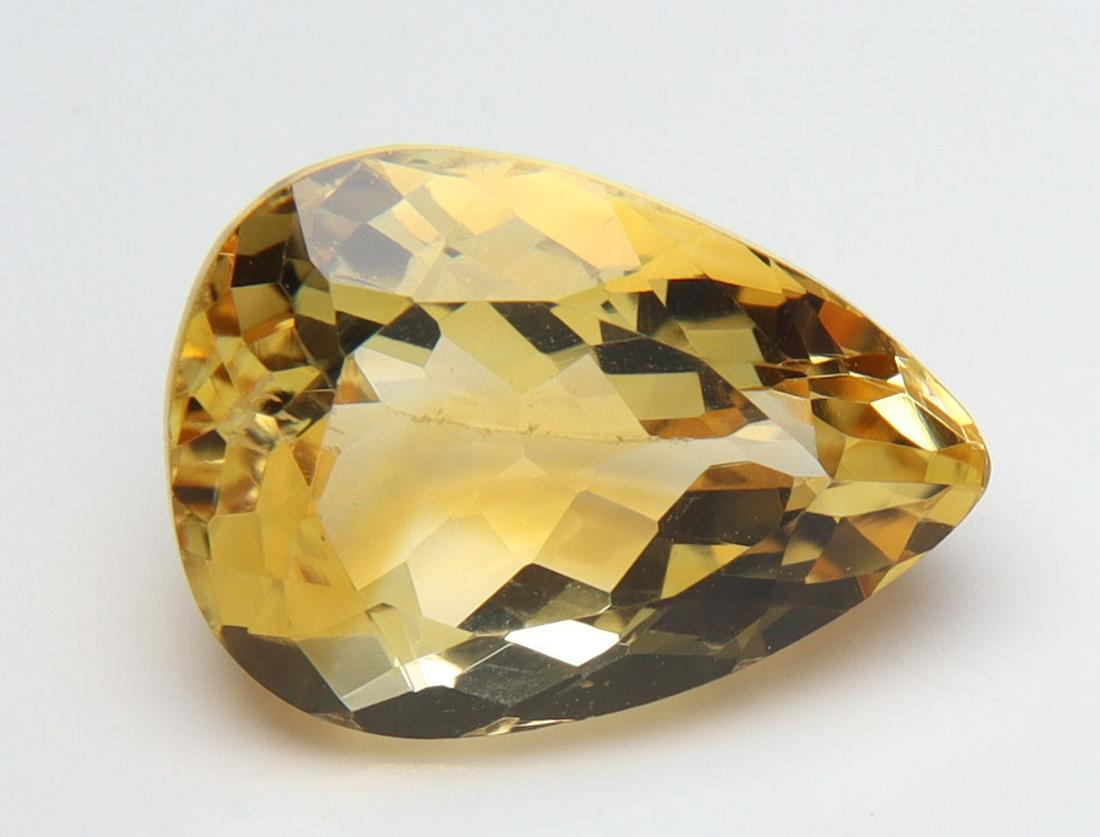 3.98 Cts Natural Citrine: No Reserve! Title: 3.98 Cts Natural Citrine Additional Information: Gemstone : Natural Citrine Origin : Brazil Weight : 3.98 carats Measurements : 12.45x8.99x6.44 mm, Shape/Cut : Pear Cut Color : Yell