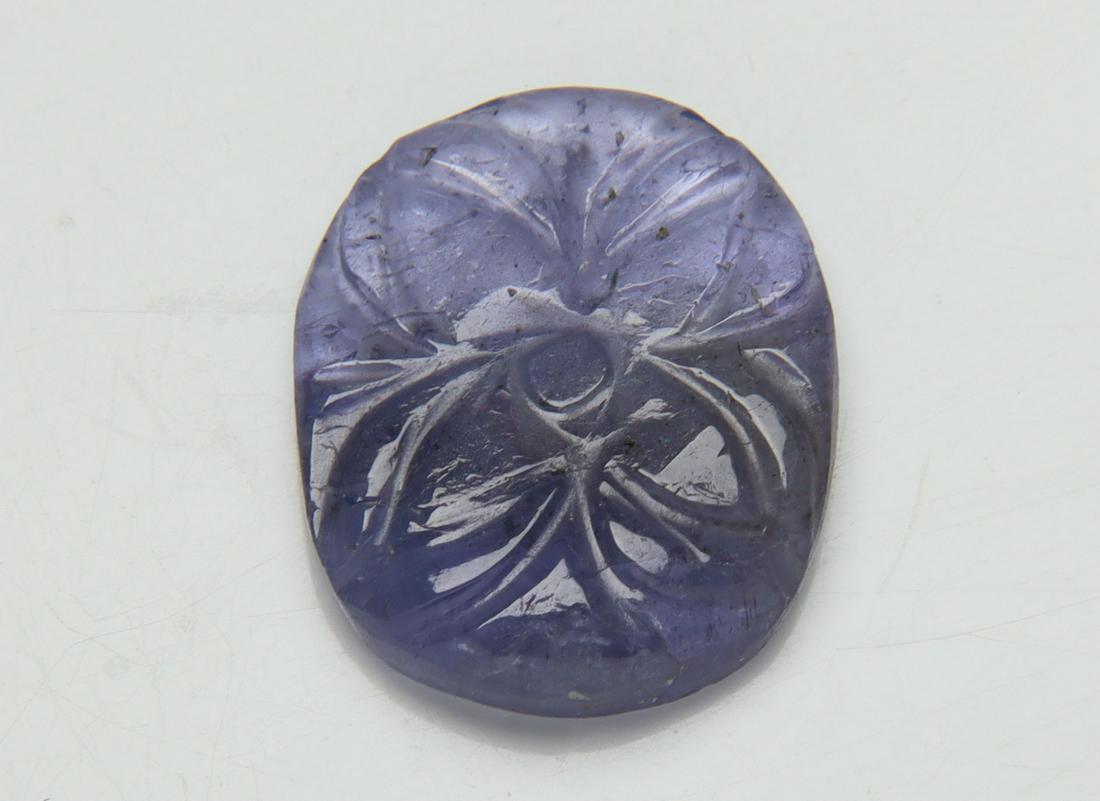7.17 Cts Natural Carving Tanzanite: No Reserve! Title: 7.17 Cts Natural Carving Tanzanite Additional Information: Gemstone : Natural CarvingTanzanite Origin: Tanzania Weight : 7.17 carats Dimensions : 16.34x13.30x3.15 mm Shape/Cut: Oval