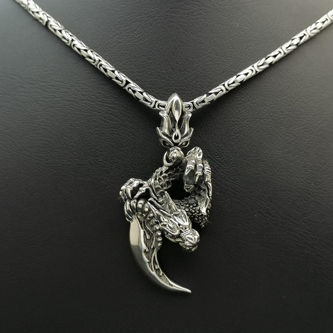 925 Silver Chain with Dragon Pendant: Title: 925 Silver Chain with Dragon Pendant Additional Information: 925 Silver Chain with Dragon Pendant -Total Weight:41g Chain Size: 23.62 in(60cm). Pendant Size:0.94x2 in (24x51mm) (Bail included).